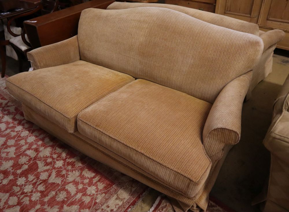 A pair of contemporary beige upholstered two seater settees, width 180cm depth 106cm max height 80cm